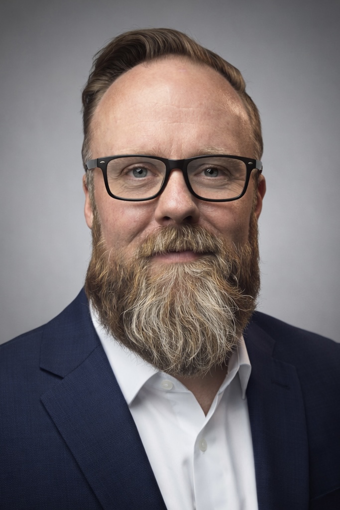 Professional headshot of Marc J. Mims